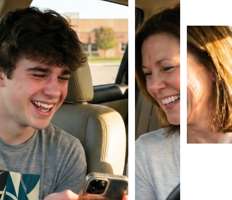 Teen and parent smiling together inside a car while looking at a phone
