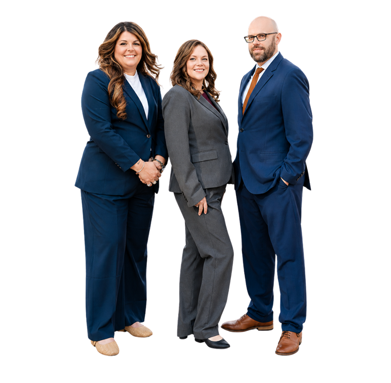 Three experienced attorneys standing together in professional business attire